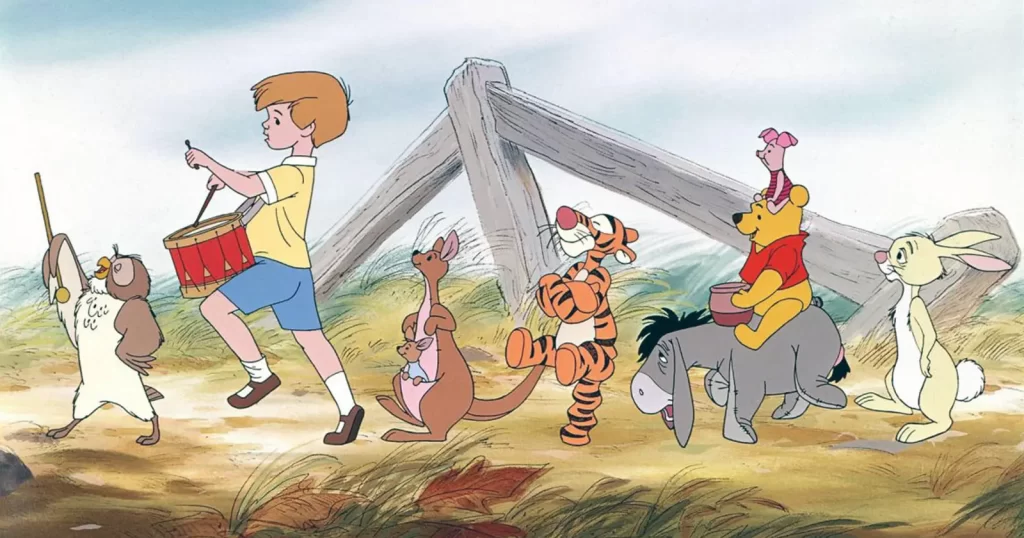 Winnie the Pooh și prietenii săi, alături de Christopher Robin, într-o scenă din animația Disney