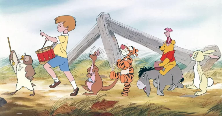 Winnie the Pooh și prietenii săi, alături de Christopher Robin, într-o scenă din animația Disney